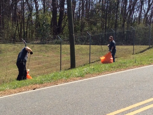 City of Monroe employees cleaning up trash